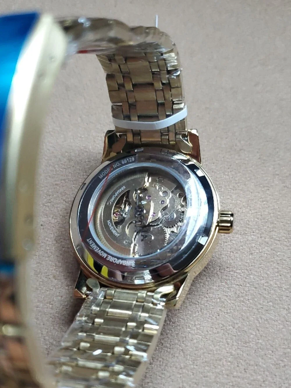 Invicta Men’s Gold Automatic Skeleton Dial Watch with Black Roman Markers